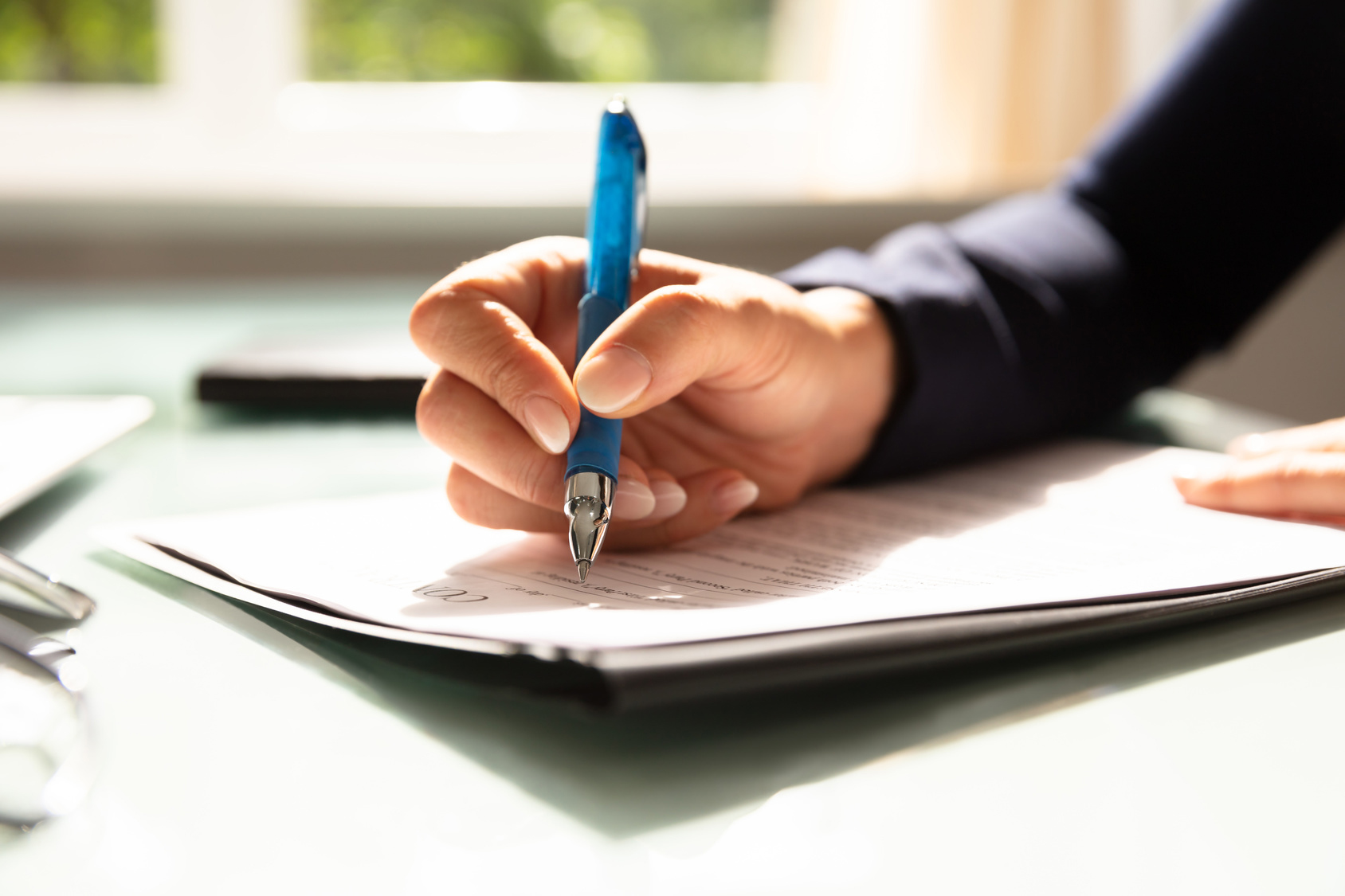Businesswoman Filling Contract Form